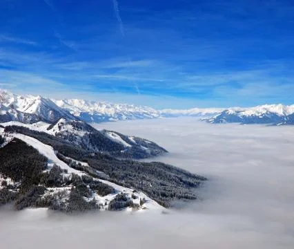 High mountains above the clouds Stock Photos