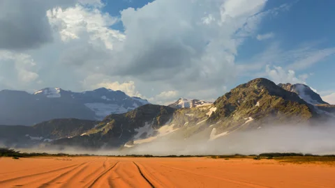 High mountains beyond a sandy desert Stock Footage 141215031