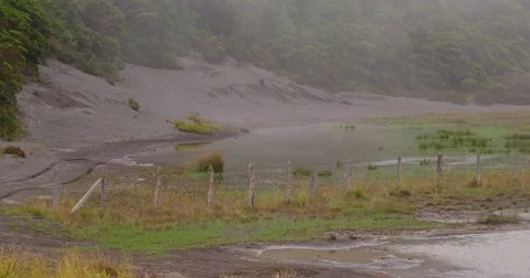 High in the mountains, the clouds descended on a beautiful field Stock Footage 82985487
