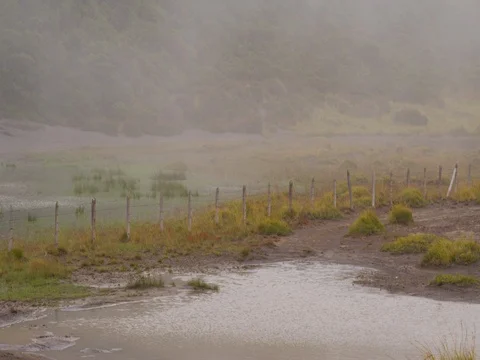 High in the mountains, the clouds descended on a beautiful field Stock Footage 82986155