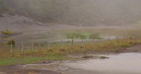 High in the mountains, the clouds descended on a beautiful field Stock Footage 82986199