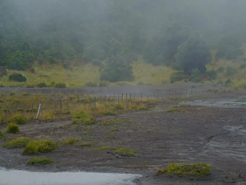High in the mountains, the clouds descended on a beautiful field Stock Footage 82991406