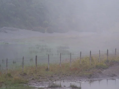 High in the mountains, the clouds descended on a beautiful field Stock Footage 82991981