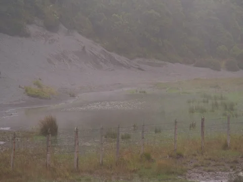 High in the mountains, the clouds descended on a beautiful field Stock Footage 82992022