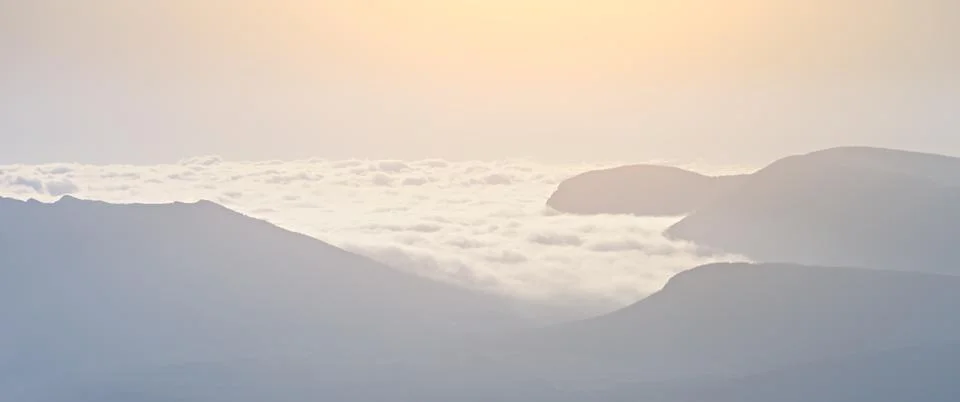 High mountains in the clouds Stock Photos