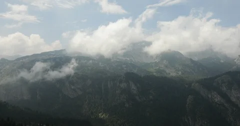 High mountains with clouds, steadicam, shot from above Stock Footage 93438290