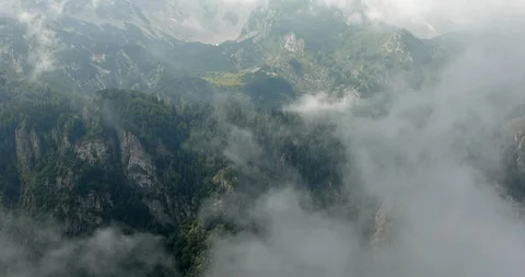 High mountains with clouds, steadicam, shot from above Stock Footage 93443027