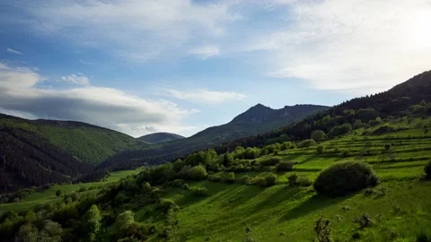 High mountains in spring green mountain landscape, rich green colors of grass 動画素材 195646356