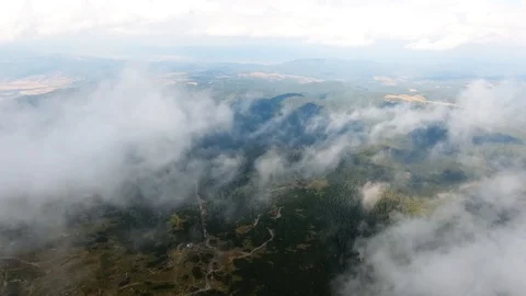 High in the mountains, the view of the earth through the clouds. Stock Footage 103057443