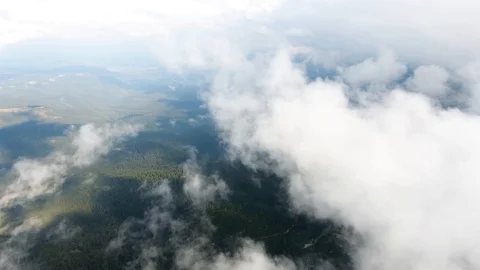 High in the mountains, the view of the earth through the clouds. Stock Footage 103057506