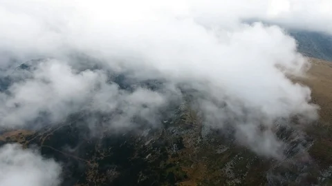 High in the mountains, the view of the earth through the clouds. Stock Footage 103057508