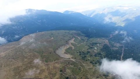 High in the mountains, the view of the earth through the clouds. 스톡 동영상 103057539