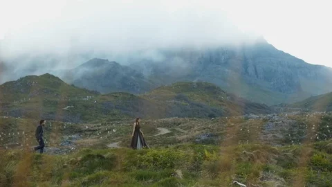 High In The Mountains, A Young Man Approached The Girl And Suddenly Made Her A Stock Footage 99743419