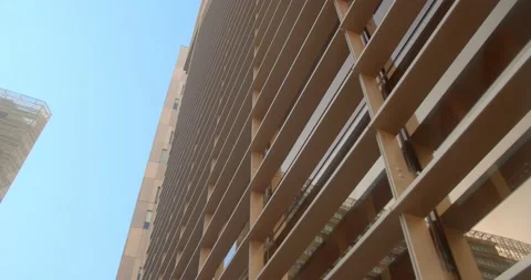 High office building. camera slowly moves along the wall of an office skyscraper 動画素材 156766020