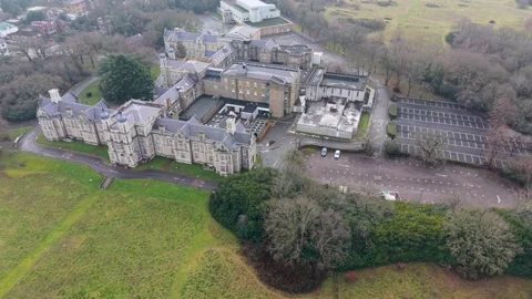 High orbit shot of Snaresbrook Crown Court showing architecture and grounds. Stock Footage 327691037