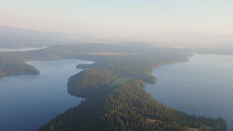 High over the haze near two lakes in the evening Stock Footage 135952889