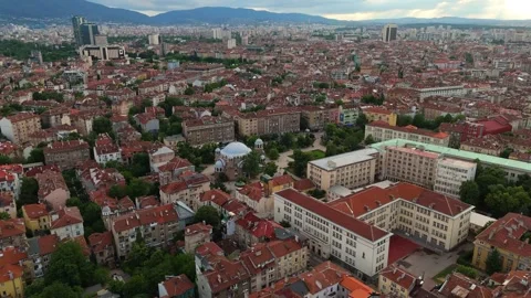 High panoramic aerial view over the sprawling city center and rooftops of Stock Footage 339096100