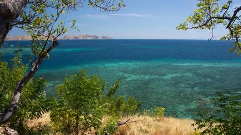 High panoramic point of view looking over the turquoise tropical ocean. Stock Photos