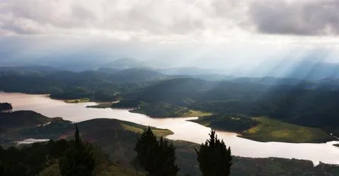 High panoramic point of view looking over a valley with brown river, Vietnam. Stock Photos