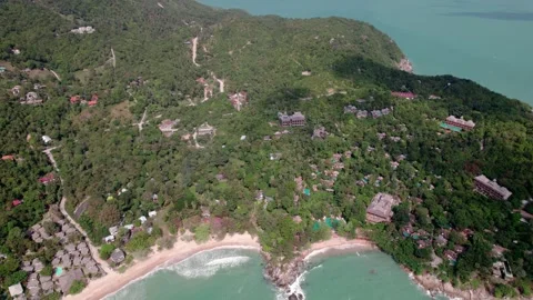 High panoramic tilt drone shot of an island, Koh Phangan, daytime and blue water Stock Footage 319891630