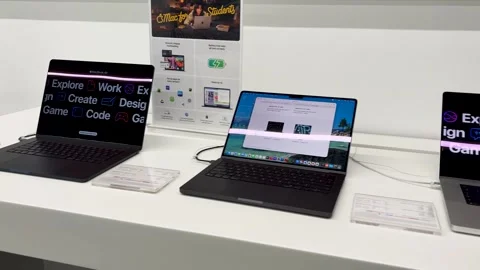 High Performance apple Laptop Models On Display Inside Consumer Electronics Stock Footage 340958056
