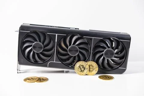 High-performance graphics card with three cooling fans and golden Bitcoin c.. Stockfoto's