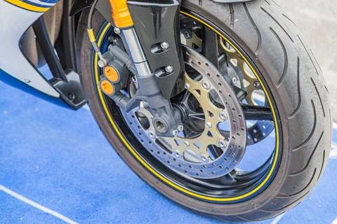High-performance motorcycle front suspension and brake system close-up Stock Photos