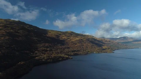 High up perspective looking over Loch Lomand and Ben Lomand Stock Footage 102394163