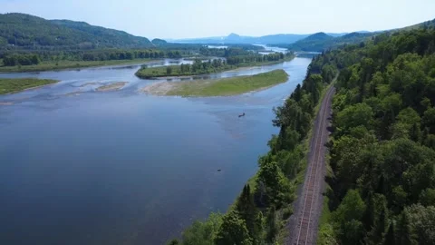 High perspective panoramic shot of a single canoe on Restigouche River. Stock Footage 341971555