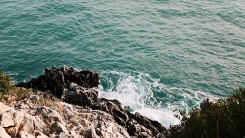High perspective static shot filmed from elevated coastal cliff Stock Footage 328932657