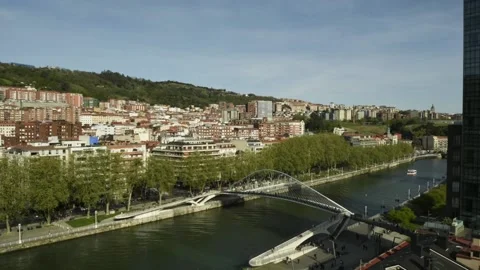 High perspective timelapse of Zubizuri arch footbridge crossing the Nervion Stock Footage 237961089