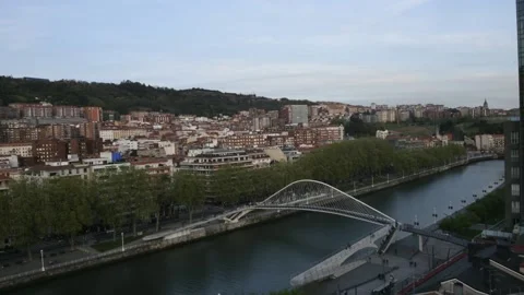 High perspective timelapse of Zubizuri arch footbridge crossing the Nervion Stock Footage 237961094