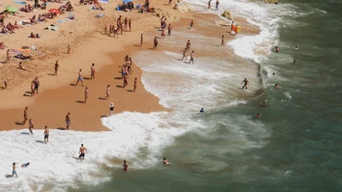High perspective view of beachgoers at Benagil beach, Algarve, Portugal Stock Footage 115885991