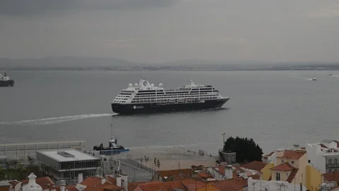 High perspective view of cruise ship sailing on Tagus River towards the Atlantic Stock Footage 97173434