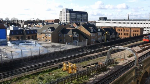 High perspective view of London Underground trains carrying passengers on the Stock Footage 102769188
