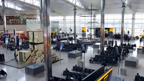 High perspective view of passengers and shops at departure terminal at Heathrow Stock Footage 103118616