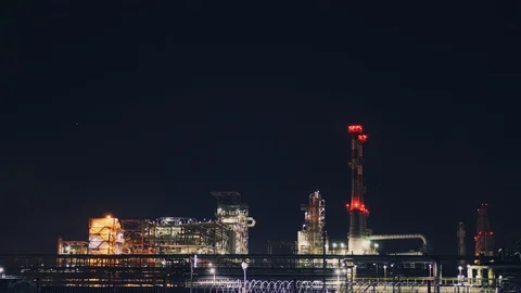 High pipes and metal structures in industrial production lit at night Stock Footage 106063715