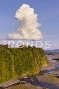 High Point Of View Of Ecuadorian River With A Big Cumulus Cloud Stock Photos