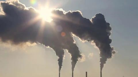 High pollution from coal power plant. Black smoke against sun. Stock Footage