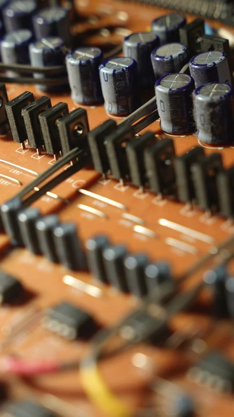 High Power Transistors and Capacitors in a Precise 3-row Array on PCB Stock Footage 331170890