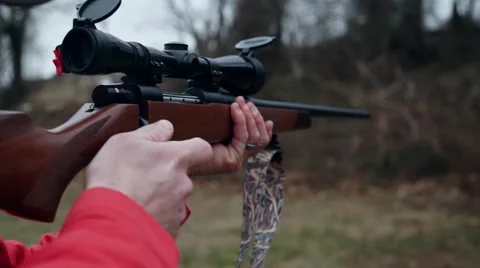 High powered rifle ejecting bullet shells Video stock 46031943