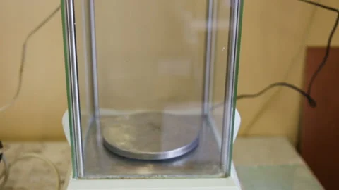 High-precision analytical scales are on the table. Camera movement from bottom t Stock Footage 85615848
