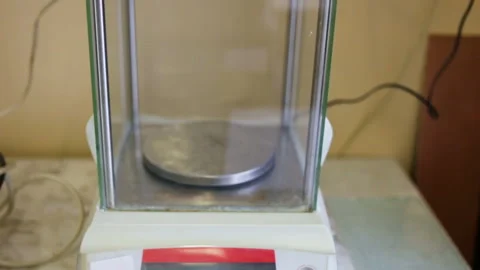 High-precision analytical scales are on the table. Movement cameras from the bot Stock Footage 85615860
