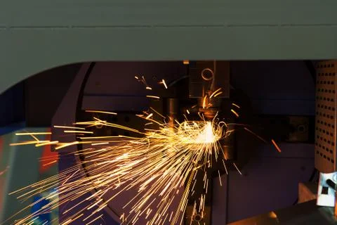 High precision CNC laser cutting metal sheet and metal pipe in factory. Stock Photos