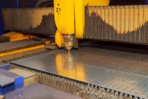 High-precision gas cutting of sheet metal using a CNC laser machine at a meta Stock Photos