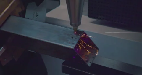 High precision machine processes a complex metal part with a laser Stock Footage 243038496