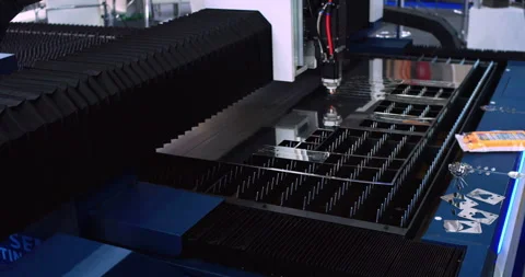 High-precision machine processing a metal part with a laser beam Stock Footage 334791897
