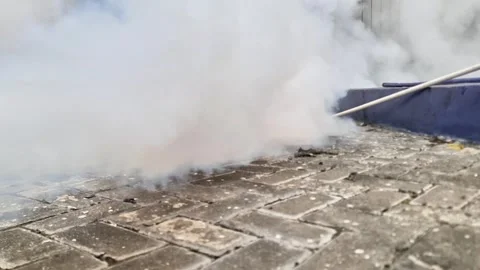 High Pressure Liquid CO2 Nozzle in Action Cold Plume Blast over Pavement Stock-Footage 332481373