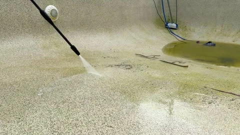 High Pressure Water Blast Cleaning Dirty Concrete Swimming Pool Surface Stock Footage 336934711