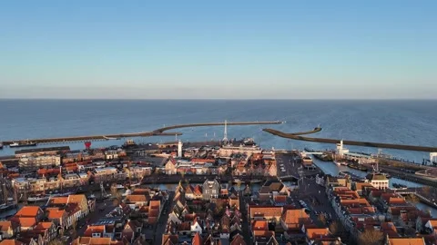 High pullback revealing full harbor city and North Sea Stock Footage 331842882